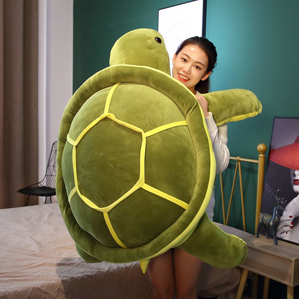 Oversized giant turtle plush pillow showing scale