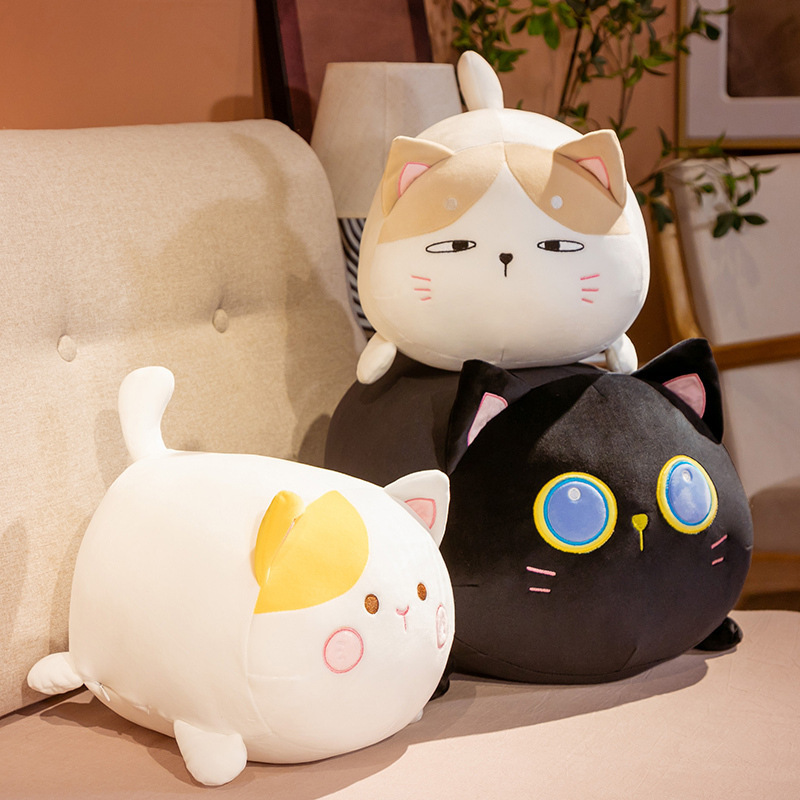 Cute chubby cat plush toy on sofa