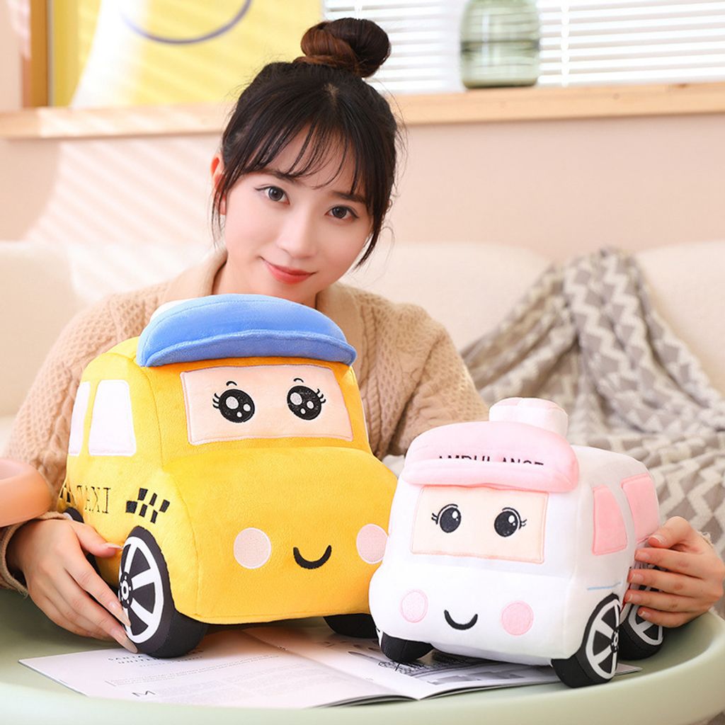 Cartoon car plush toy displayed in a cozy home setting