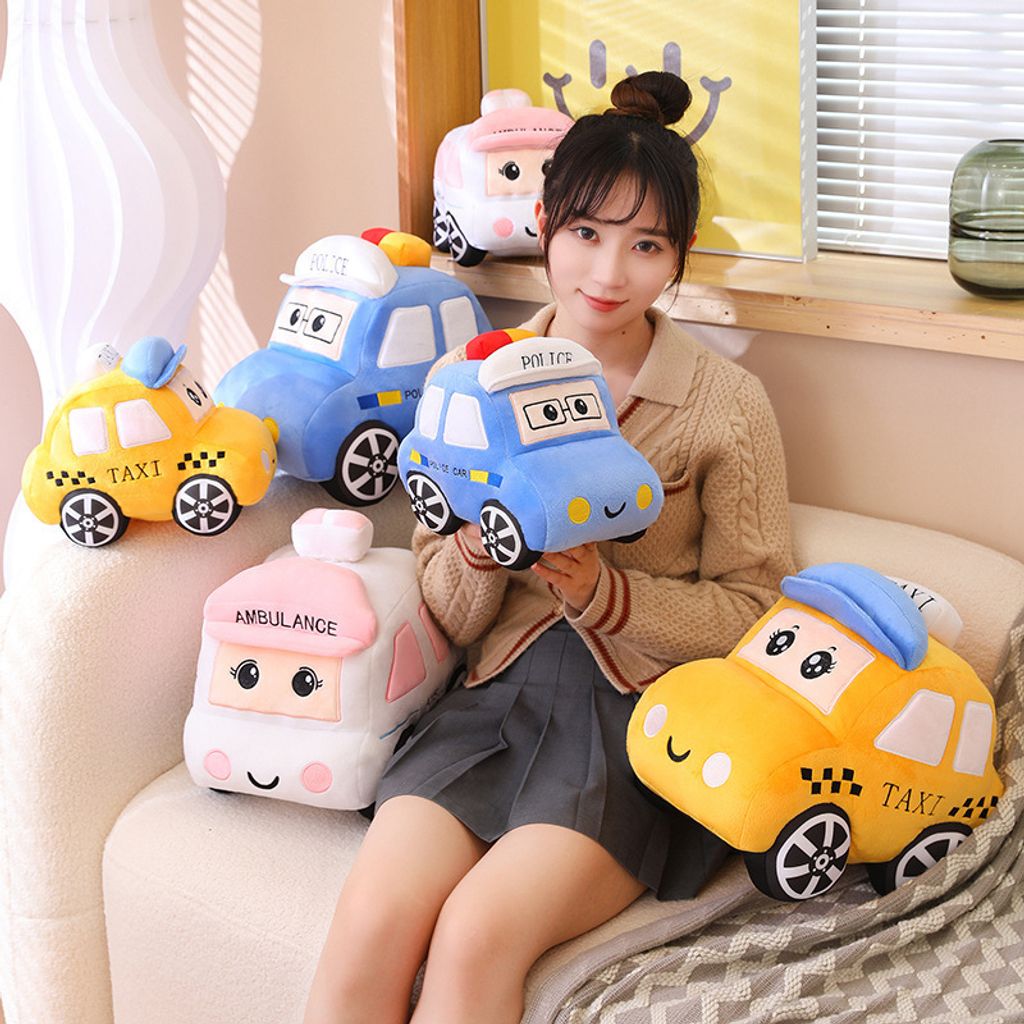 Cartoon car plush toy shown in lifestyle setting