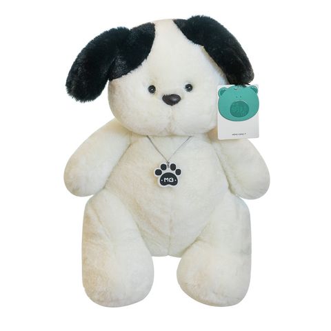 White dog plush toy with soft plush fabric on white background