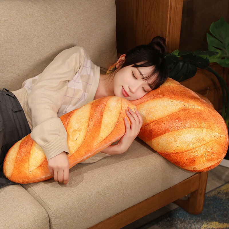 Realistic bread plush pillow used as a hugging pillow on sofa