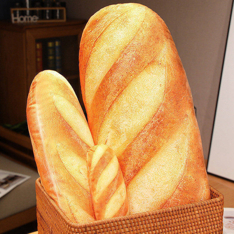 Realistic bread plush pillow shown in different sizes
