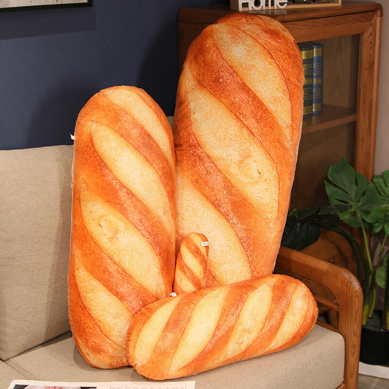 Realistic bread plush pillow on sofa for home decor