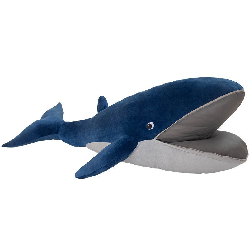 Whale plush pillow on white background