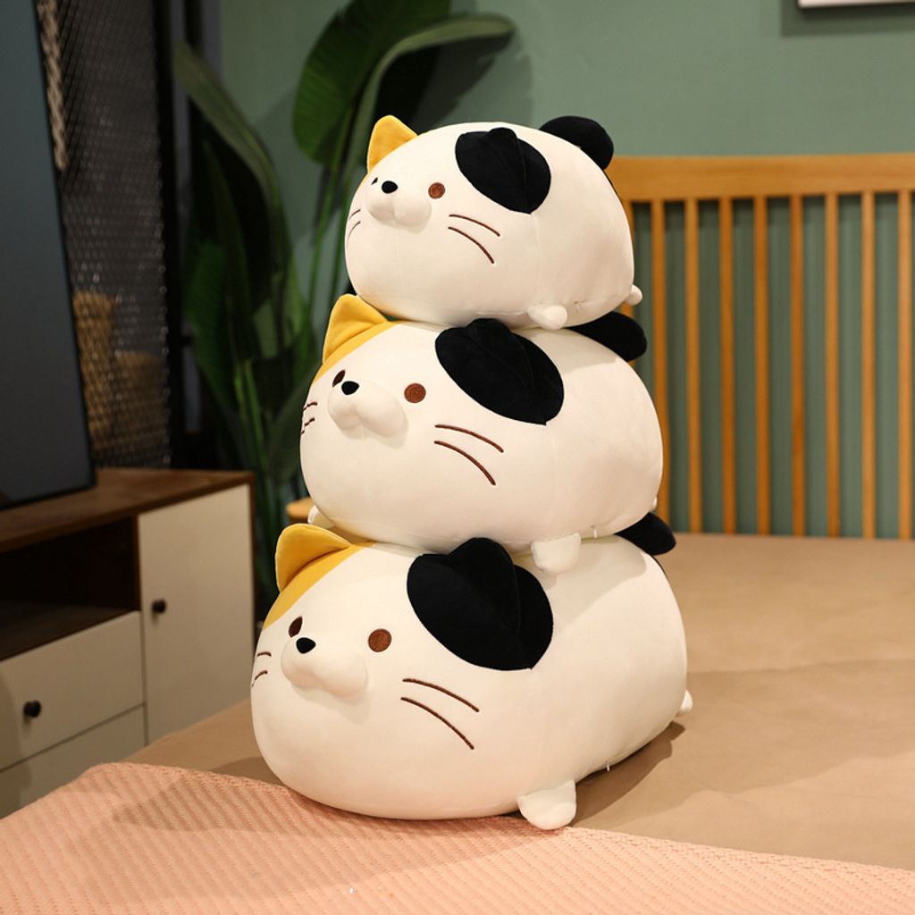 Cute round cat plush toys stacked together showing soft and round shape