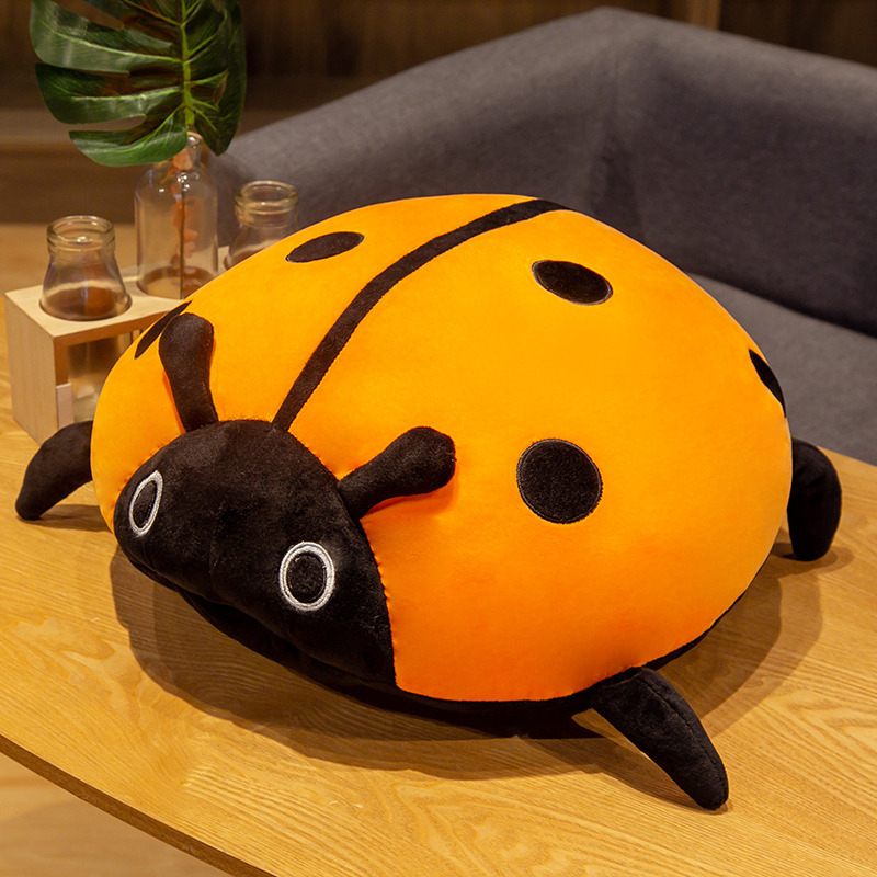 Orange ladybug plush pillow