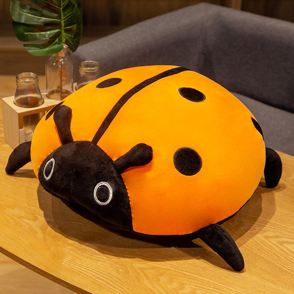 Orange ladybug plush pillow