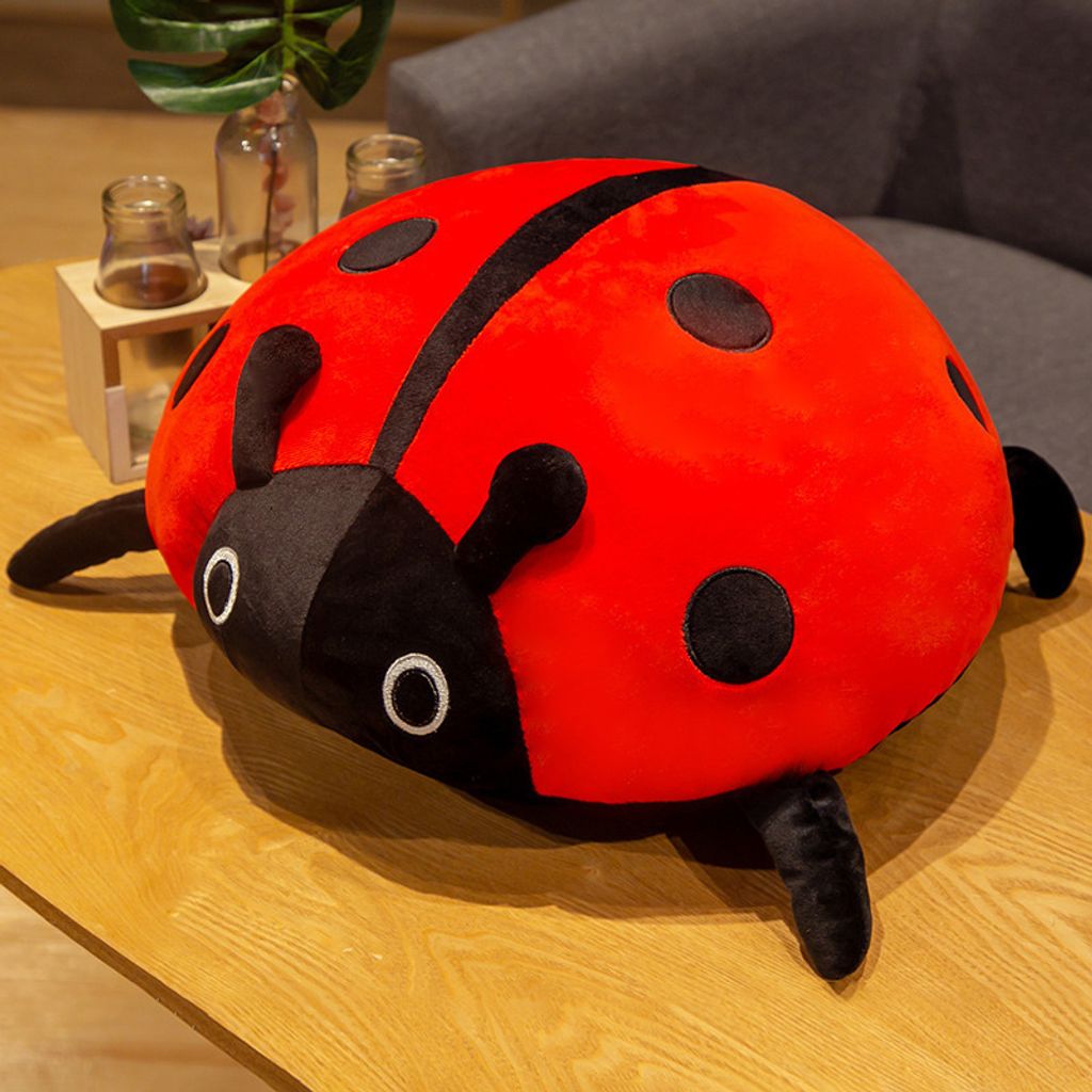Red ladybug plush pillow