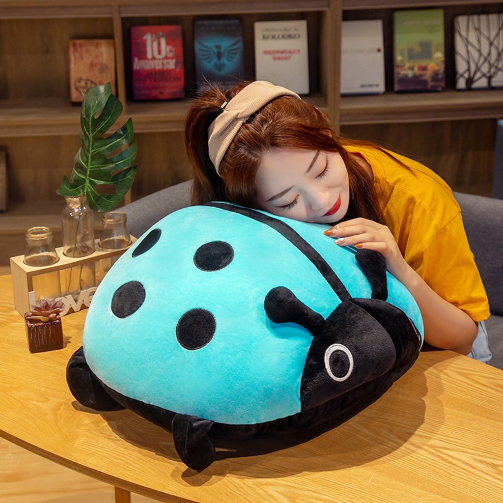 Cute ladybug plush pillow for hugging and relaxing