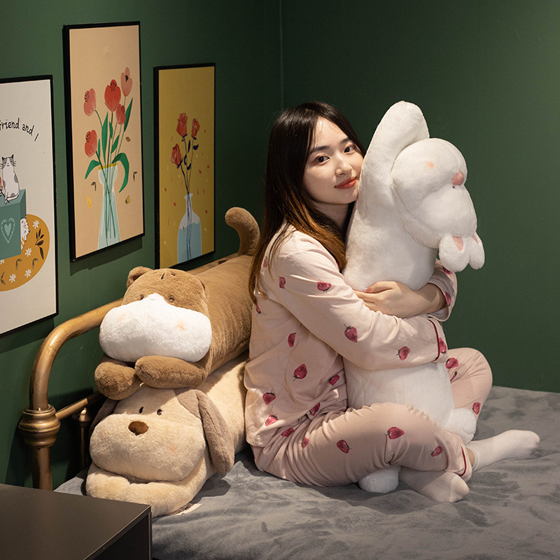 Cute lying animal plush pillow used as a cozy hugging pillow on a bed, creating a calm and relaxing bedtime atmosphere