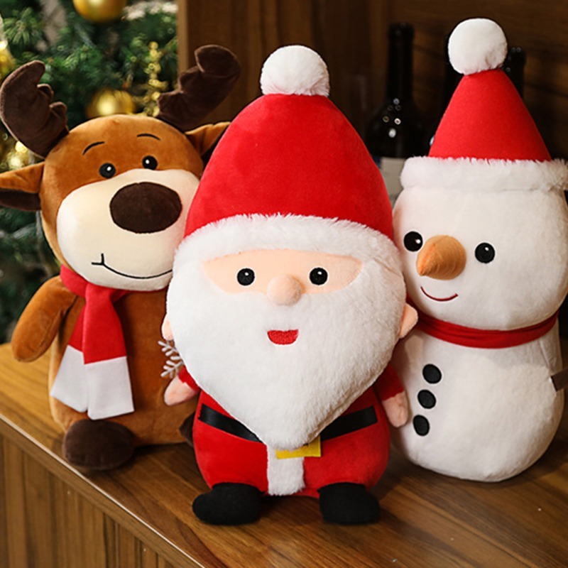 Cute Christmas plush toys featuring Santa Claus, Snowman, and Reindeer displayed together