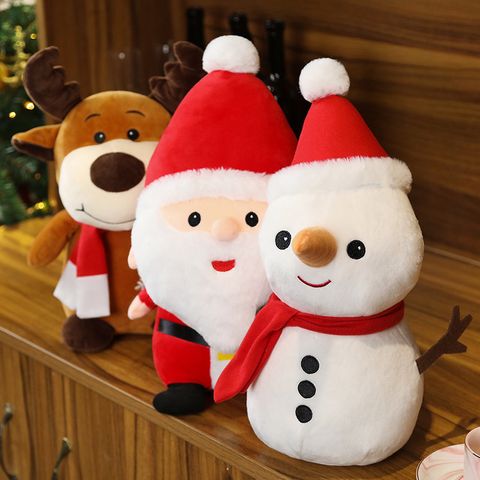 Cute Christmas plush toys featuring Santa Claus, Snowman, and Reindeer displayed together