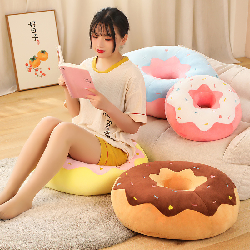 Donut plush pillow used as a soft seat cushion