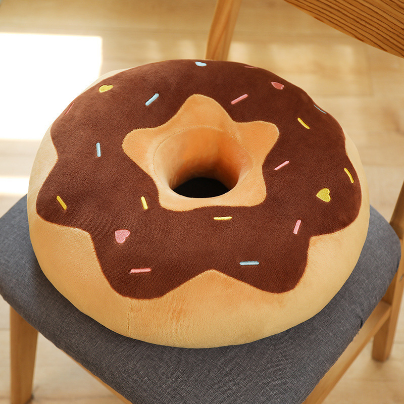 Donut plush pillow in brown and yellow