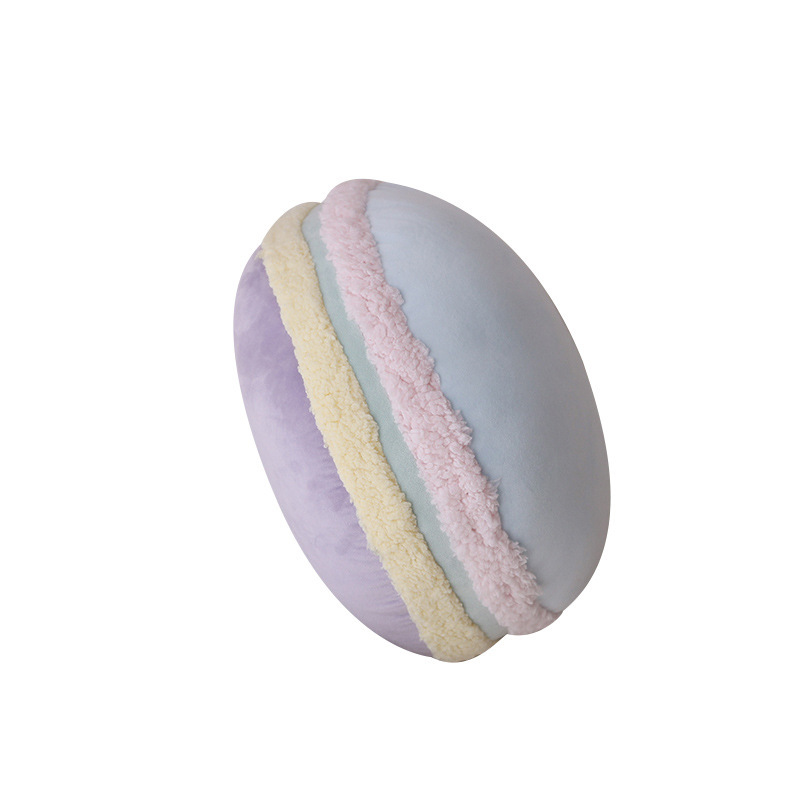 Macaron plush pillow in blue and purple on white background