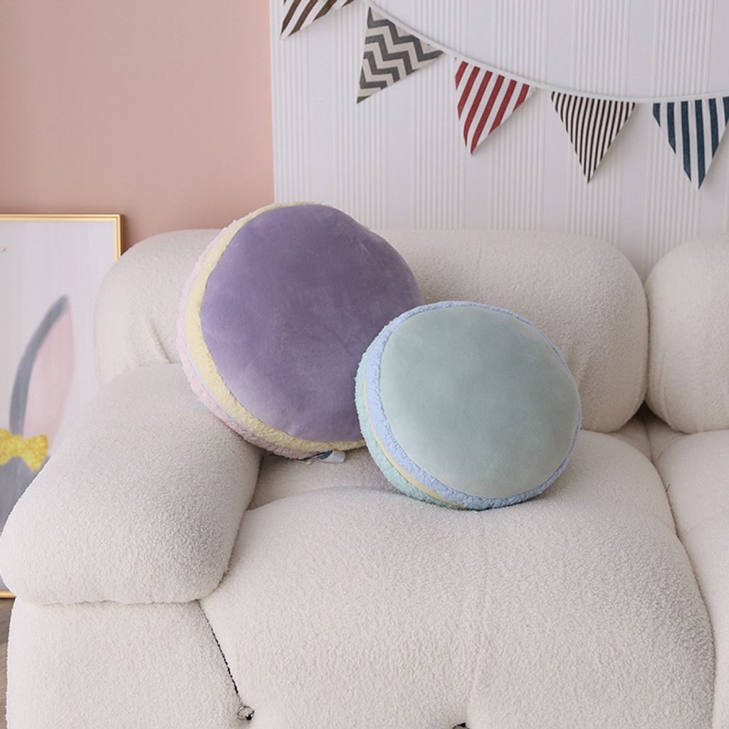 Macaron plush pillows in a cozy living room setting