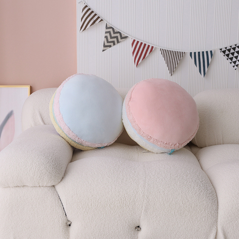 Macaron plush pillows in a cozy living room setting
