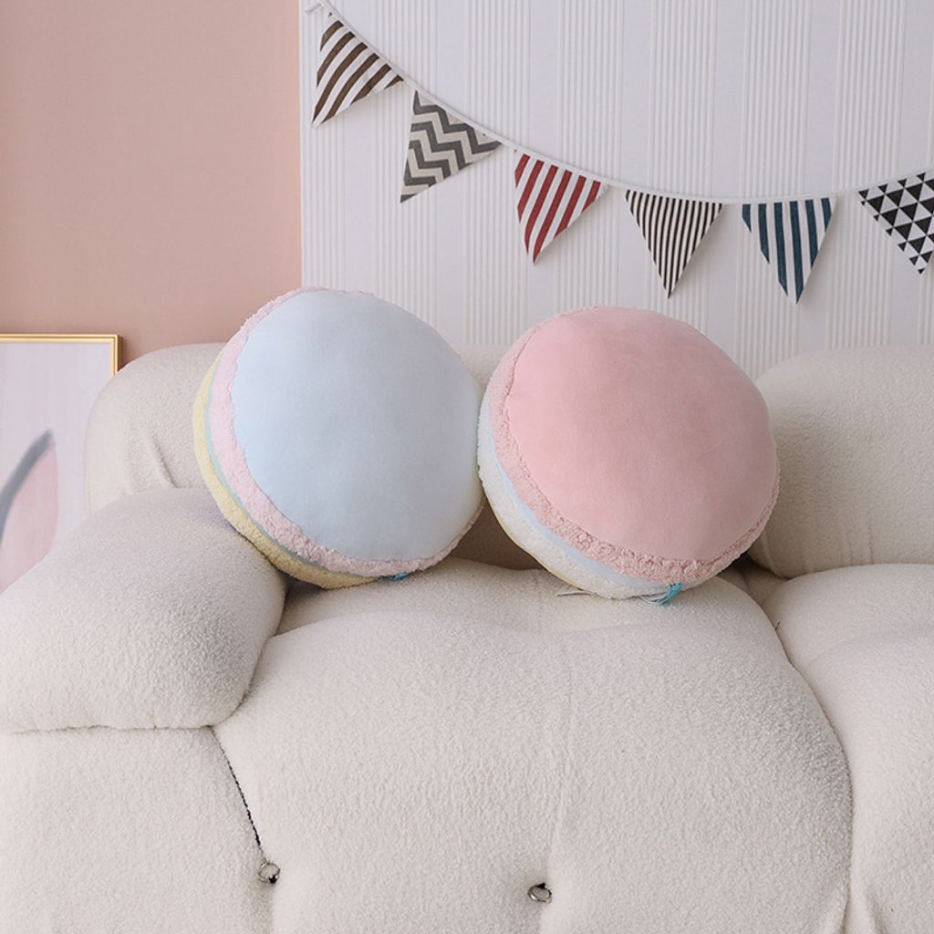 Macaron plush pillows in a cozy living room setting