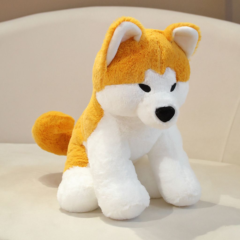 Side view of Akita Inu sitting plush toy