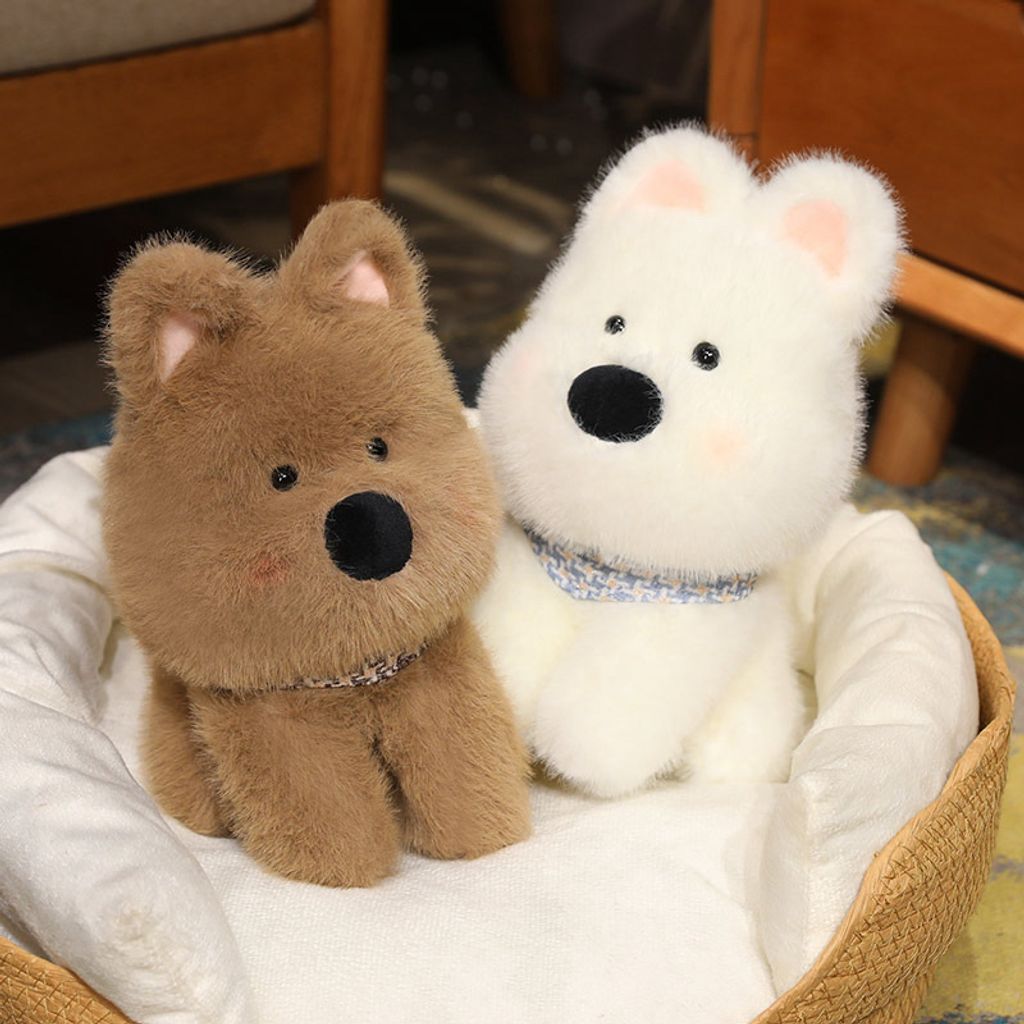 Westie dog plush toys resting in a cozy pet bed