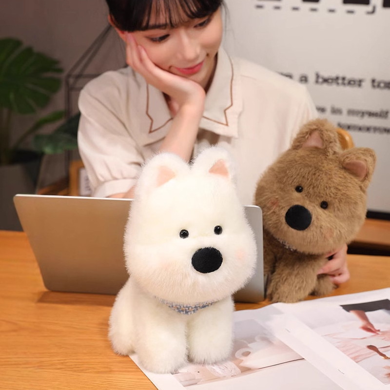 White and brown Westie dog plush toys on a desk for cozy moments