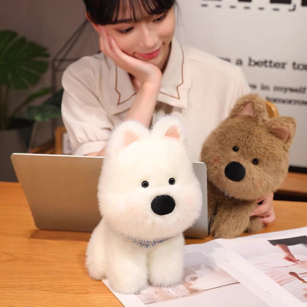 White and brown Westie dog plush toys on a desk for cozy moments