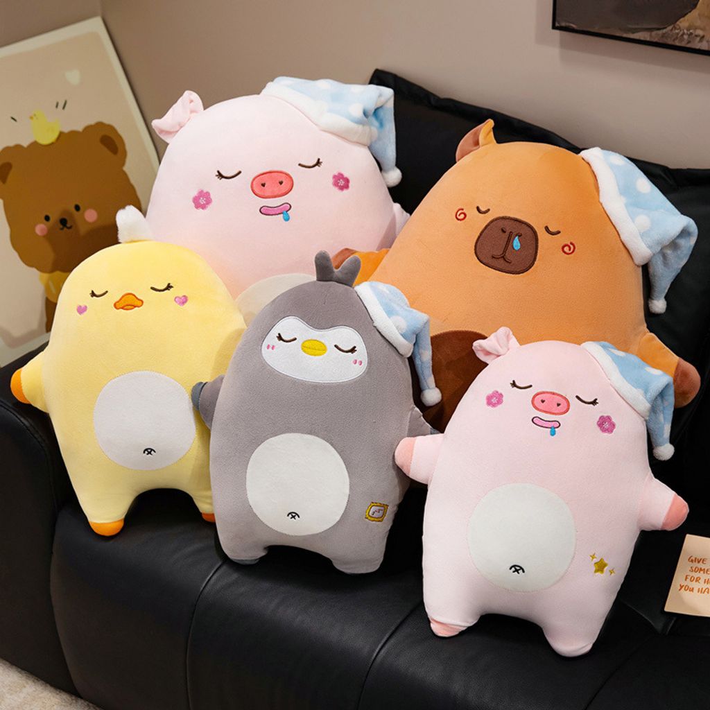 Sweet dreams animal plush pillow collection featuring capybara, duck, pig, and penguin designs