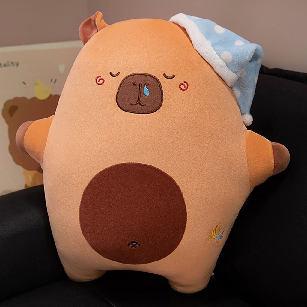 Sweet dreams animal plush pillow in capybara design with sleep hat