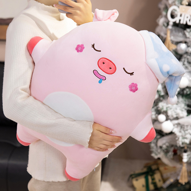 Sweet dreams pig plush pillow held in arms for size reference