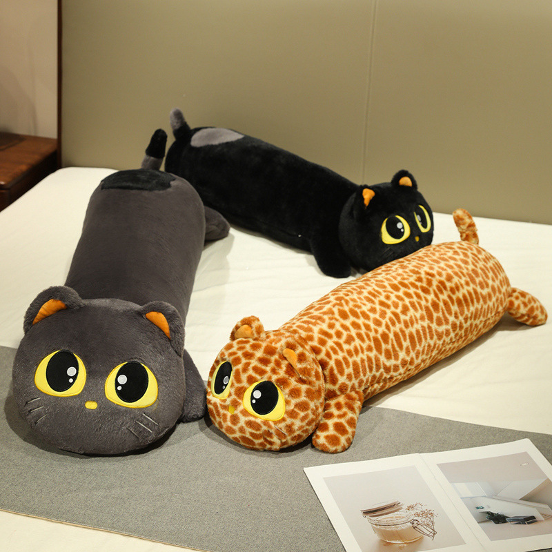 Gray, leopard print, and black cute lying cat long plush pillows on bed