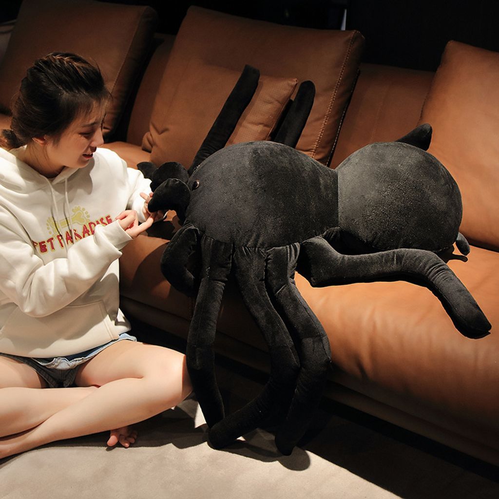 Giant spider plush pillow showing detailed legs and shape