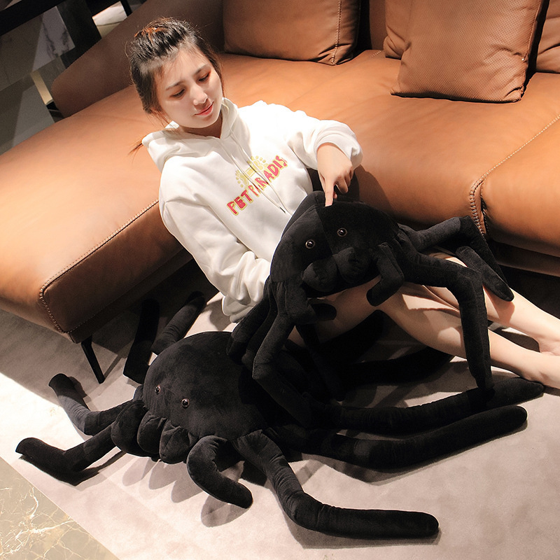 Giant spider plush pillow in two different sizes