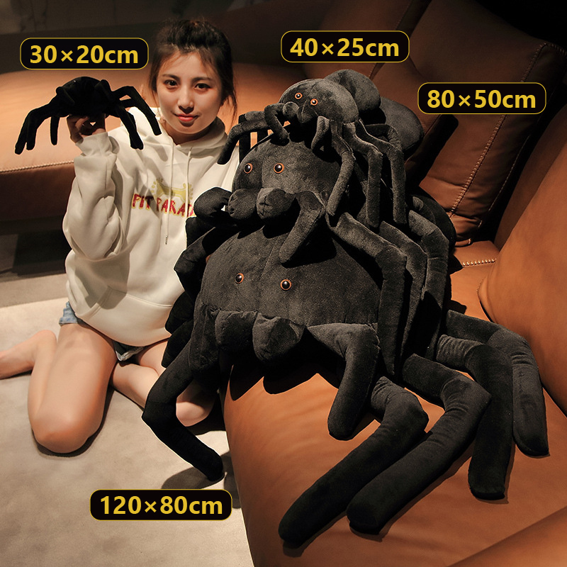 Giant spider plush pillow shown in all four sizes