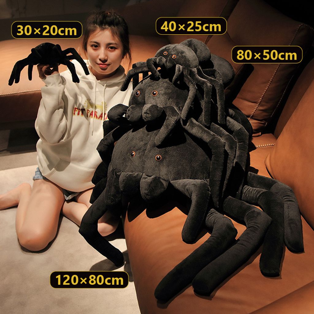 Giant spider plush pillow shown in all four sizes
