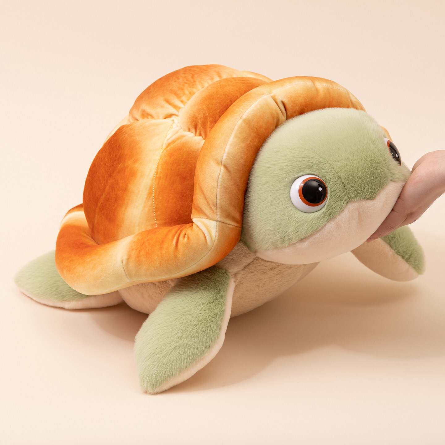 Bread turtle plush toy with soft bread shell and green flippers side view