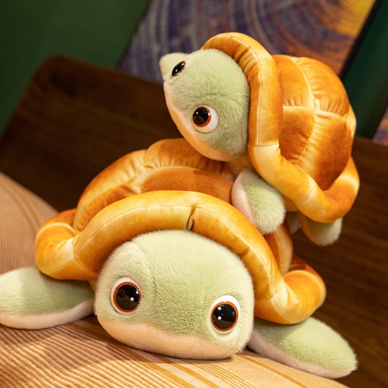 Stacked bread turtle plush toys showing cute green faces, fluffy bread shells, and soft flippers in a cozy room