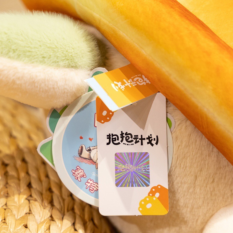 Close up of bread turtle plush toy tag and soft plush fabric texture