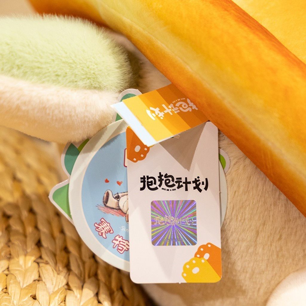 Close up of bread turtle plush toy tag and soft plush fabric texture