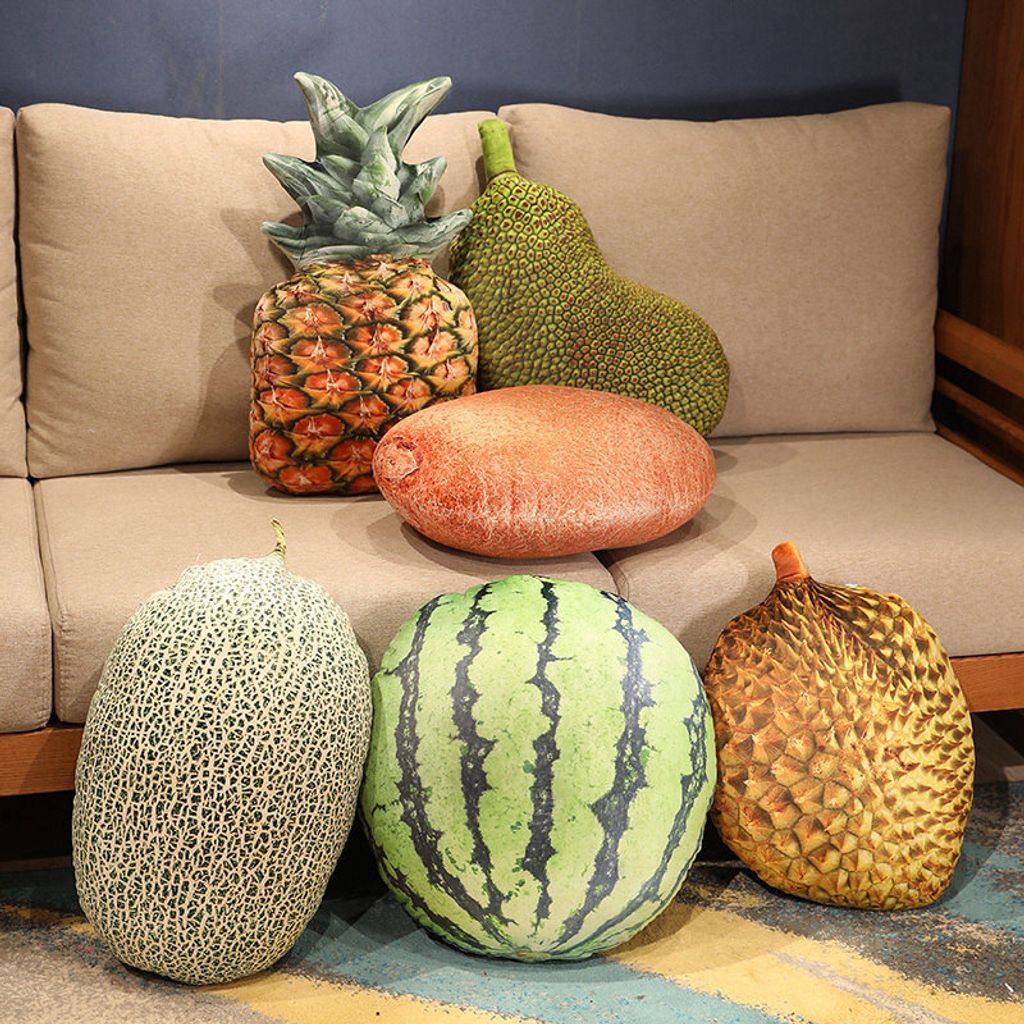Realistic fruit plush pillows featuring cantaloupe, watermelon, durian, pineapple, and jackfruit on the floor