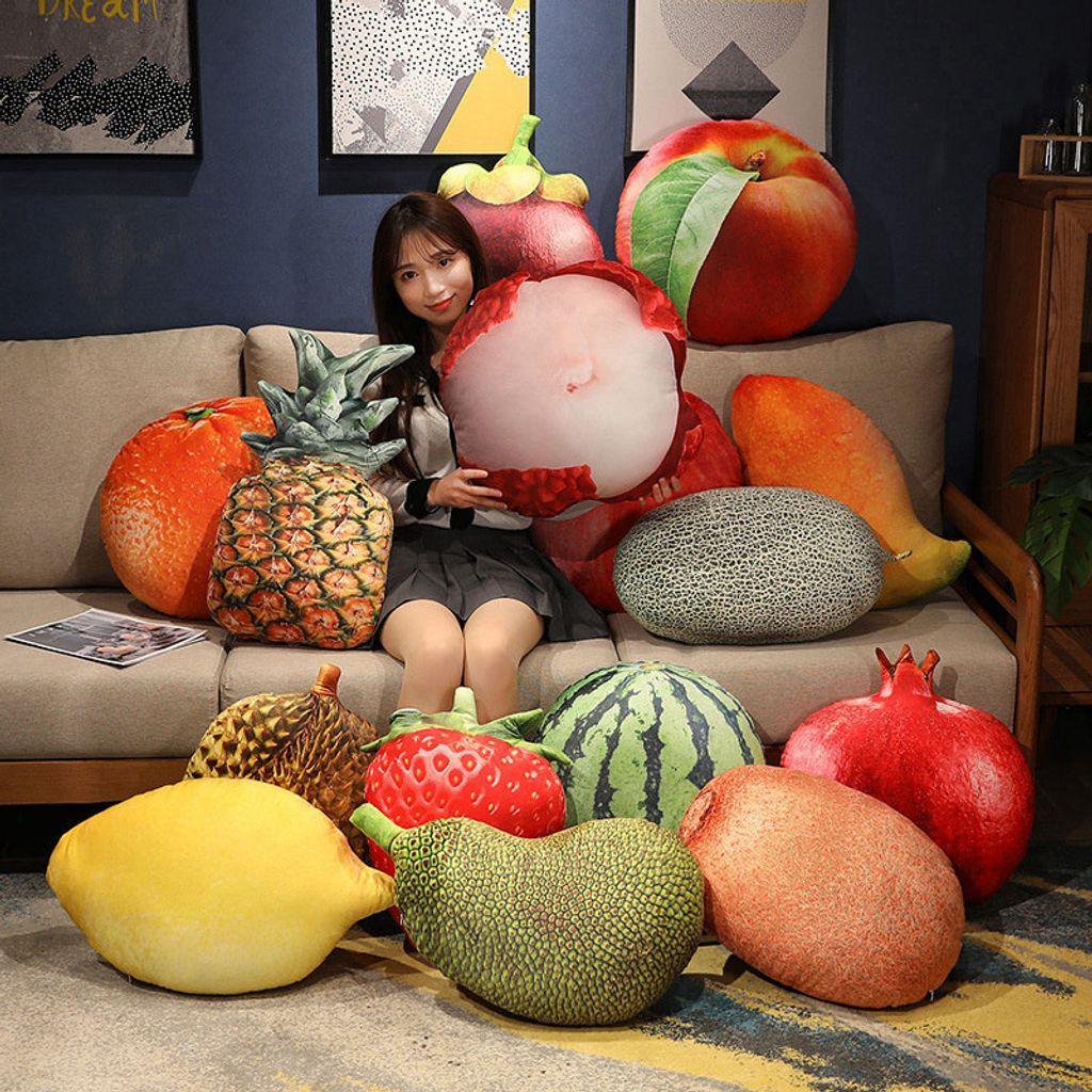 Realistic fruit plush pillows featuring lychee, pineapple, watermelon, lemon, jackfruit, and strawberry on a sofa