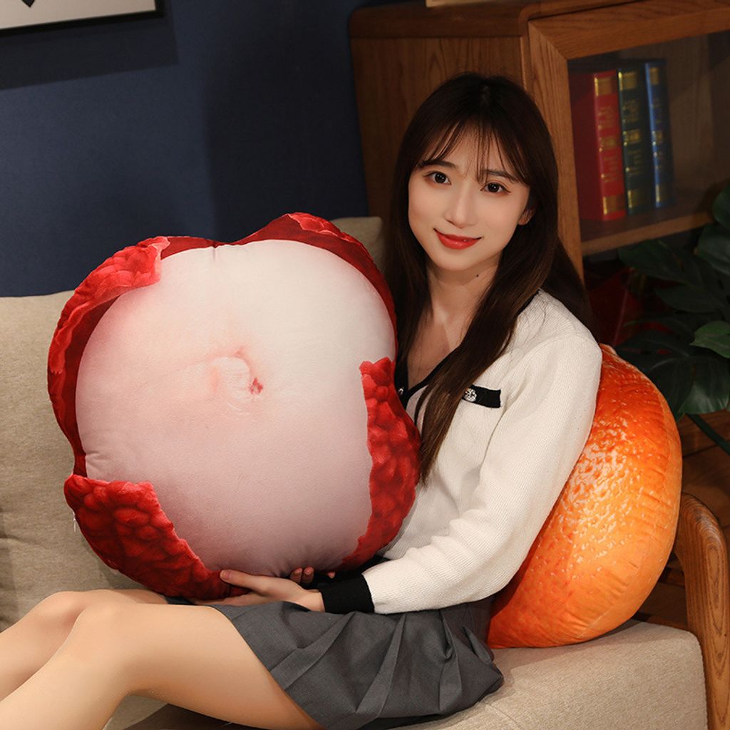 Lychee plush pillow used as a soft decorative fruit cushion in a cozy living room