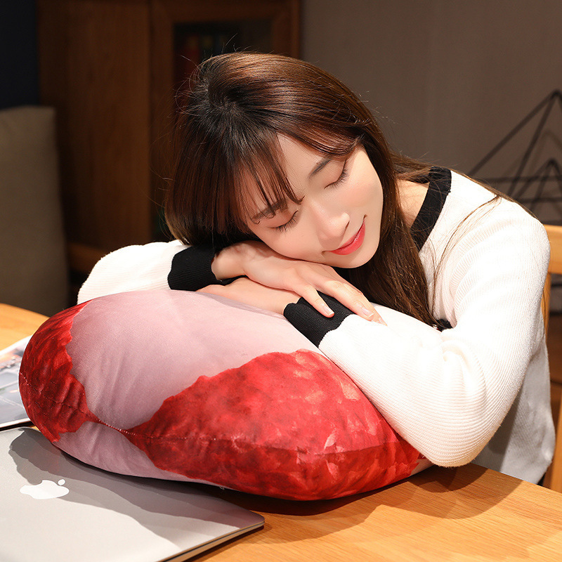 Lychee plush pillow used as a comfortable cushion on a chair beside a laptop