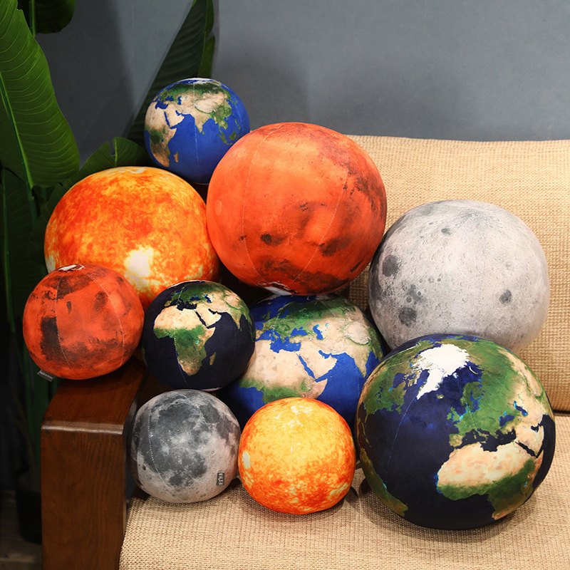 Planet plush pillow size comparison with multiple designs