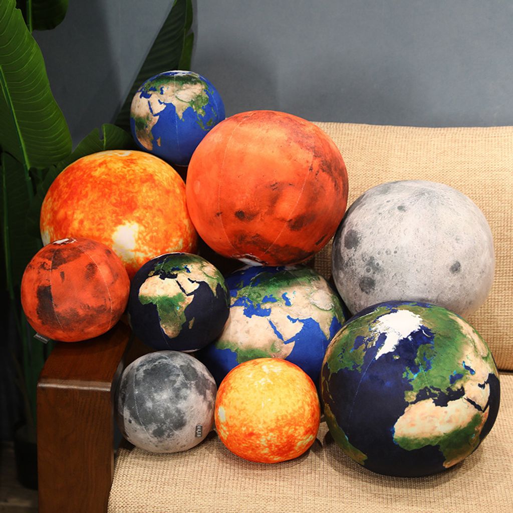 Planet plush pillow size comparison with multiple designs