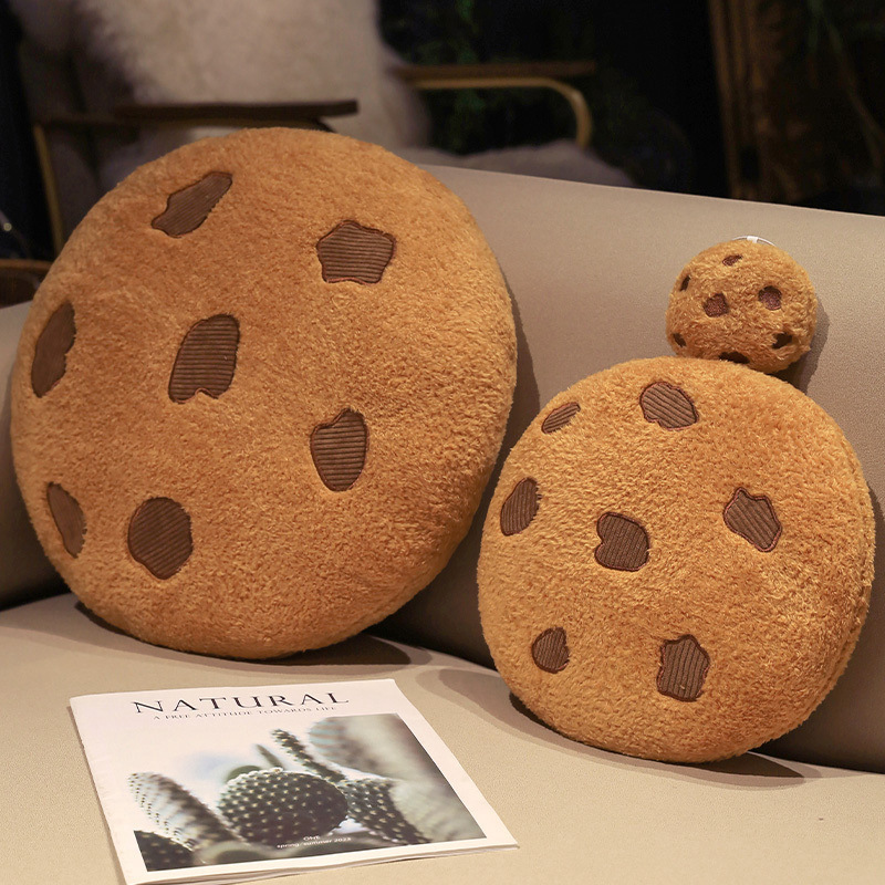 Cookie plush pillow in three sizes on sofa
