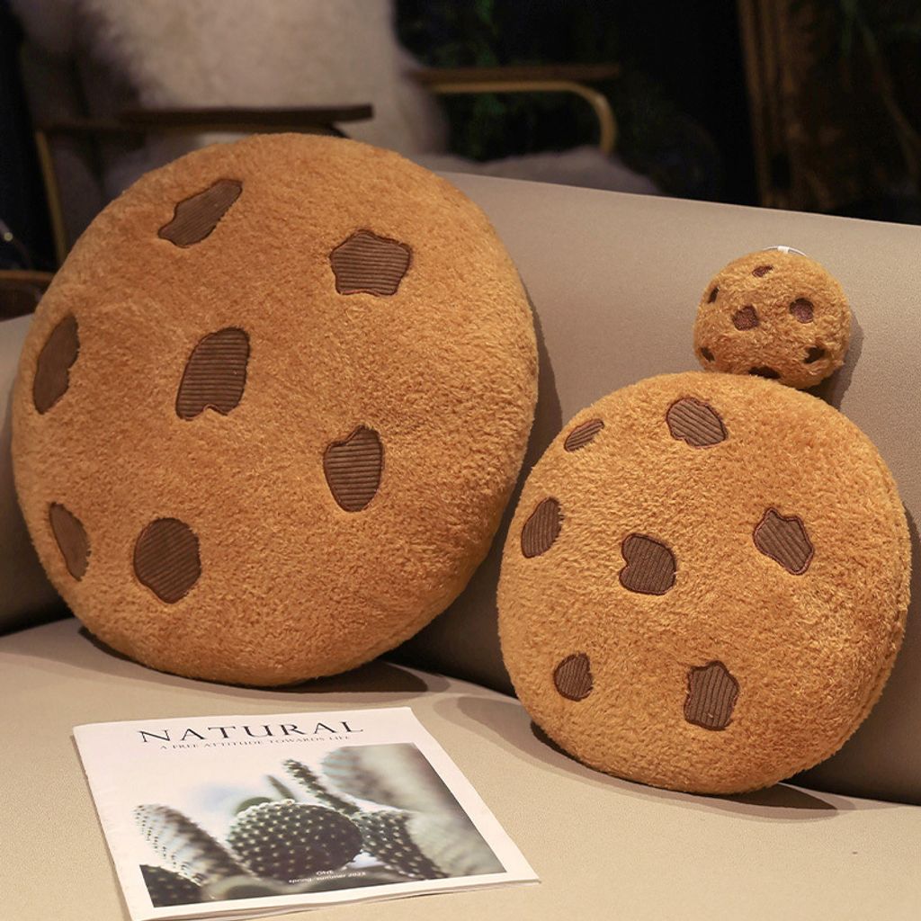 Cookie plush pillow in three sizes on sofa