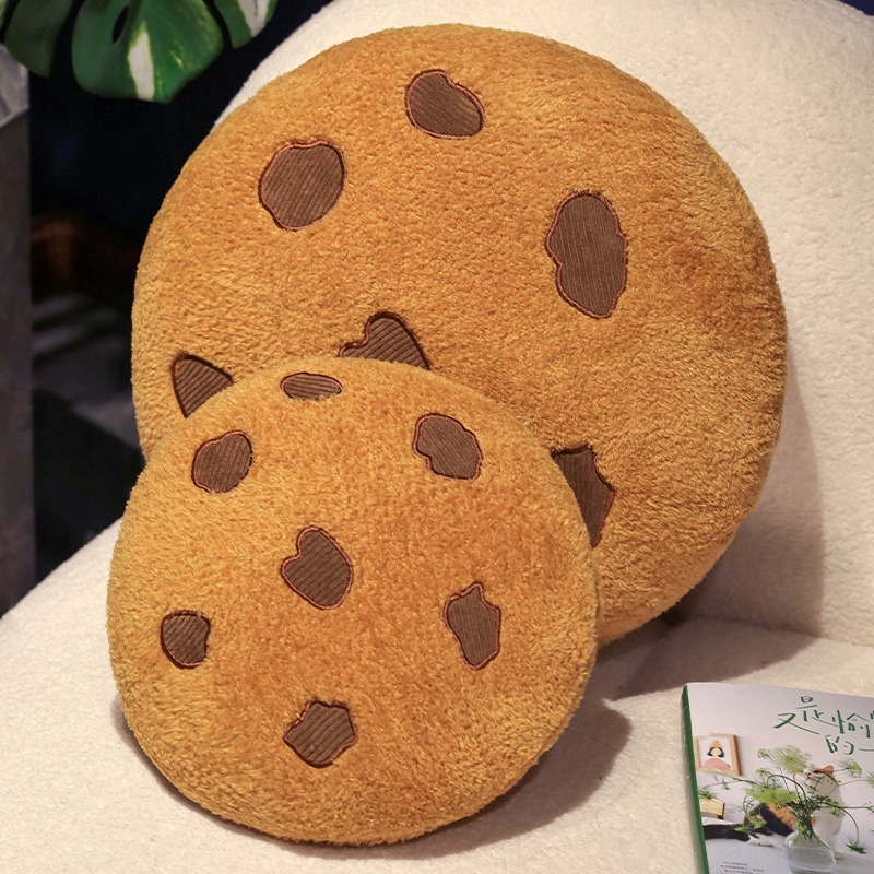 Cookie plush pillow in different sizes on sofa