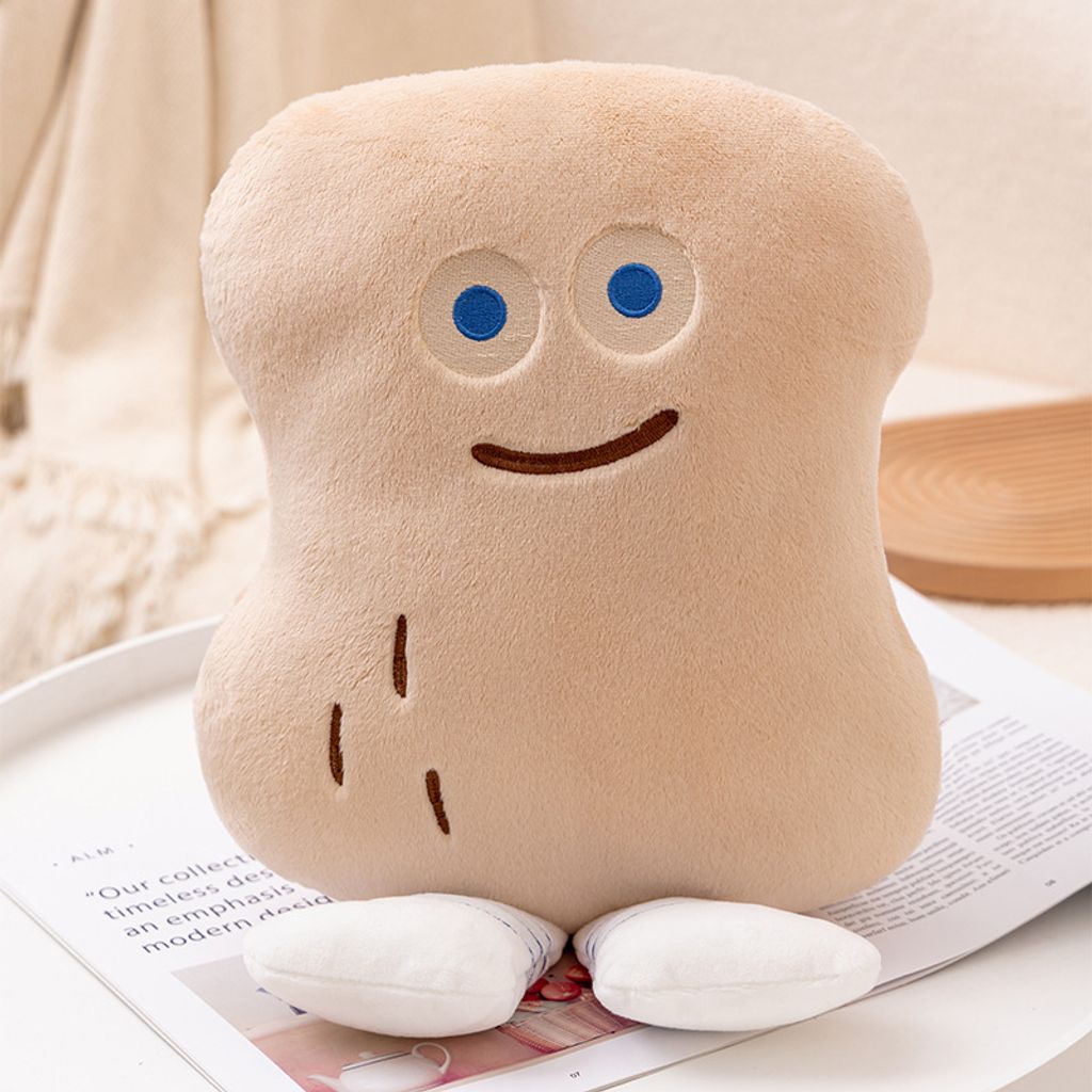 Peanut Bun plush pillow with blue eyes and smiling face displayed on a small table