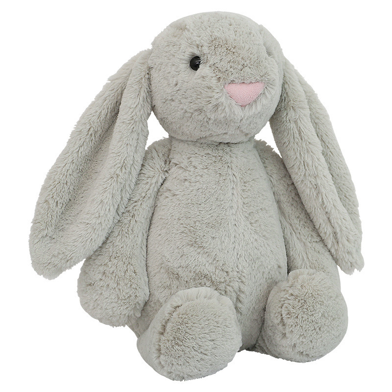 Cute lop ear bunny plush toy in gray color on white background